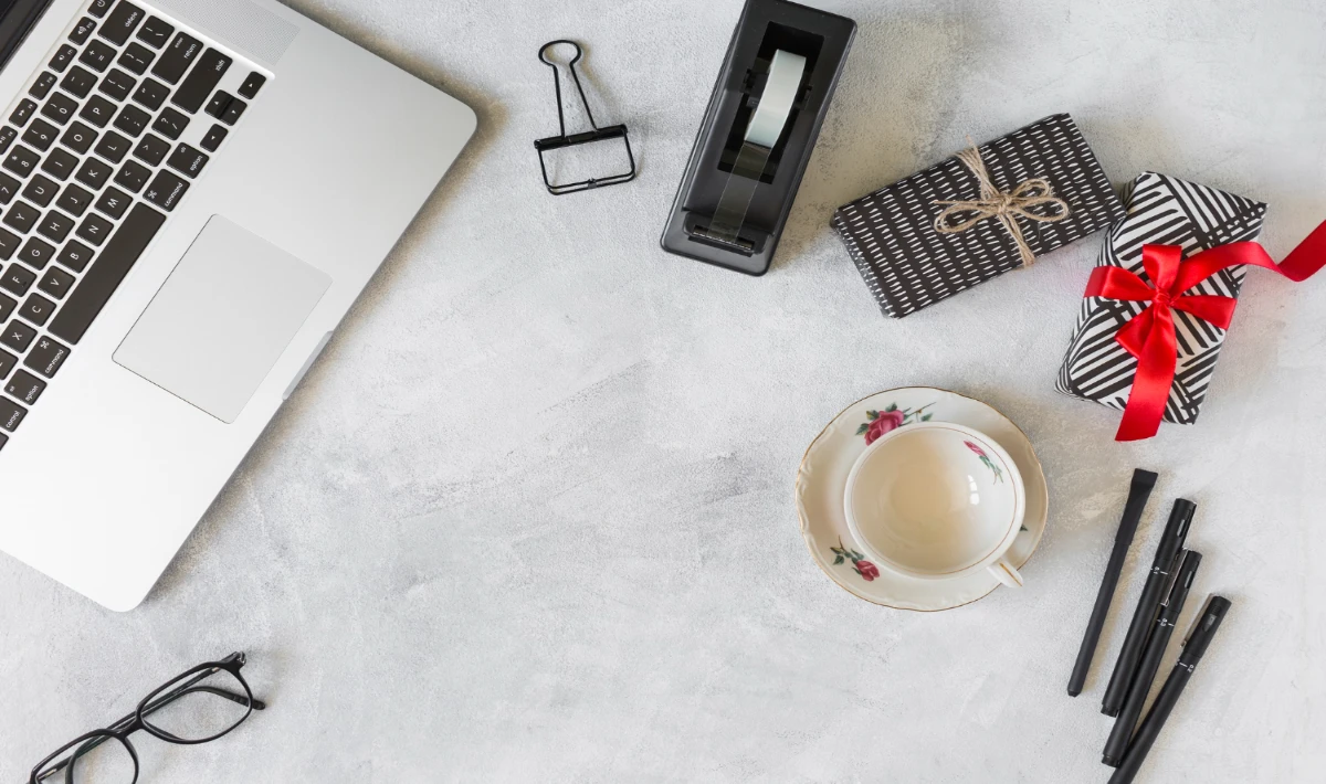 Minimal white themed Christmas desk decor with cotton snow and ornaments