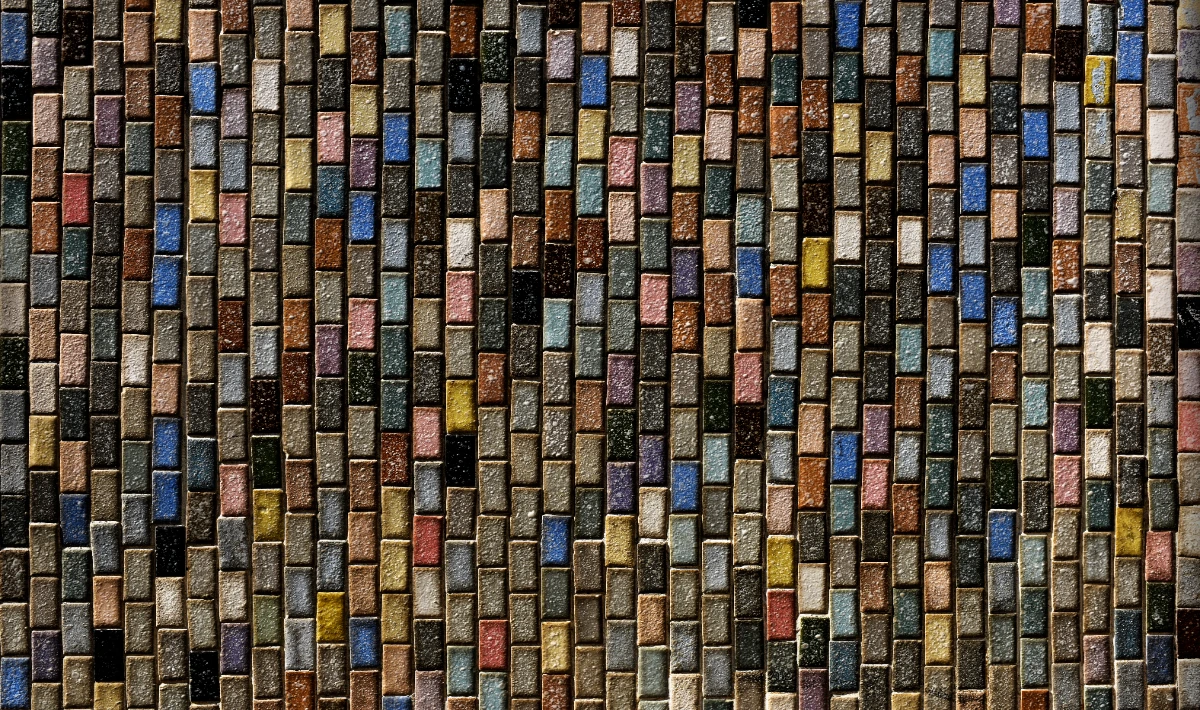 Mixed office textures blending metal, wood and fabric for added depth