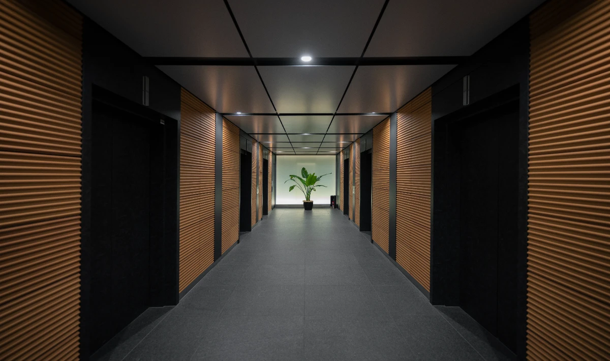 Three-dimensional wooden wall panels creating depth in office interiors