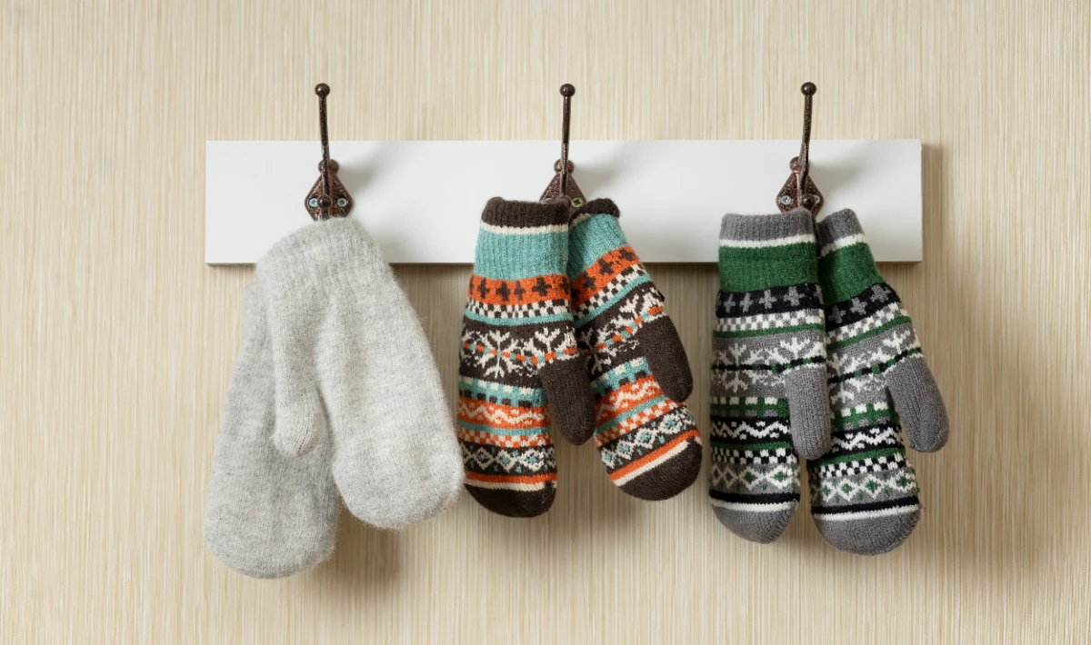 Mini Christmas stockings hung on office desks to bring a cheerful touch