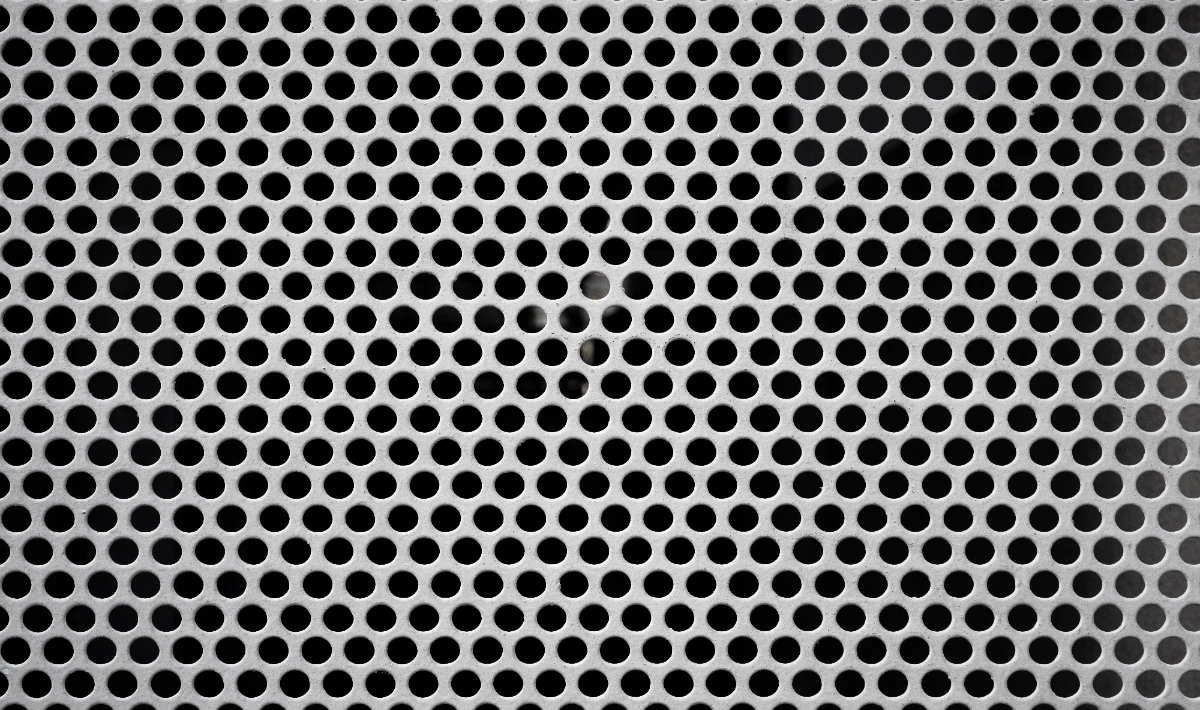 Perforated metal office ceiling design for modern ambient use.
