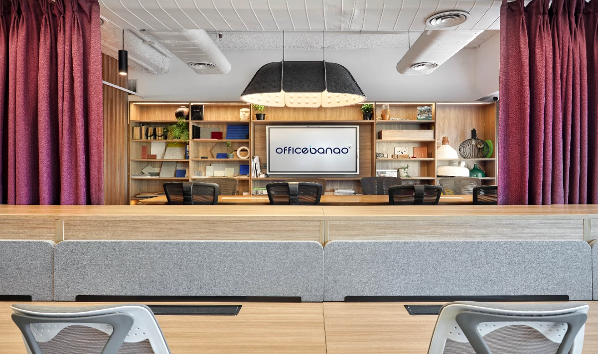 Modular storage wall with built-in shelves in a small workspace