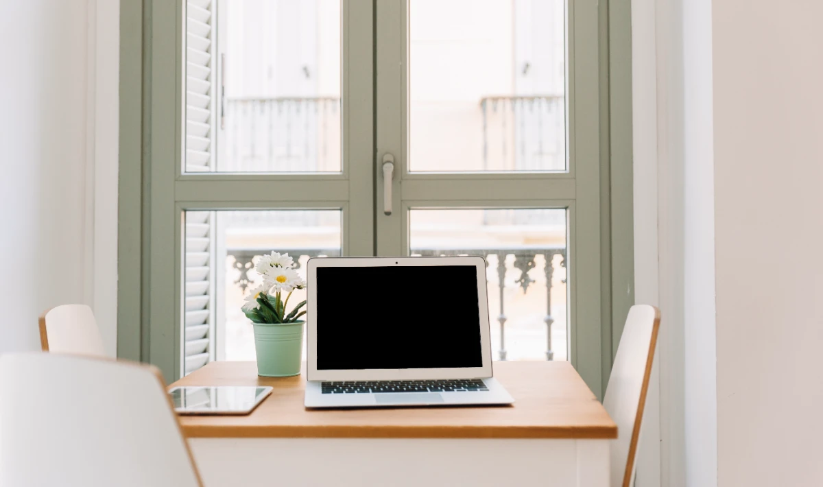 Home office design ideas show a desk placed near a window for focus