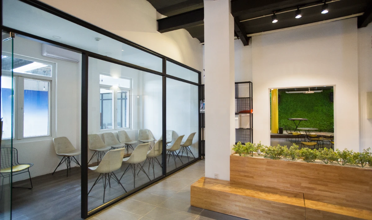 Glass partitions used in modern small office interior design layouts