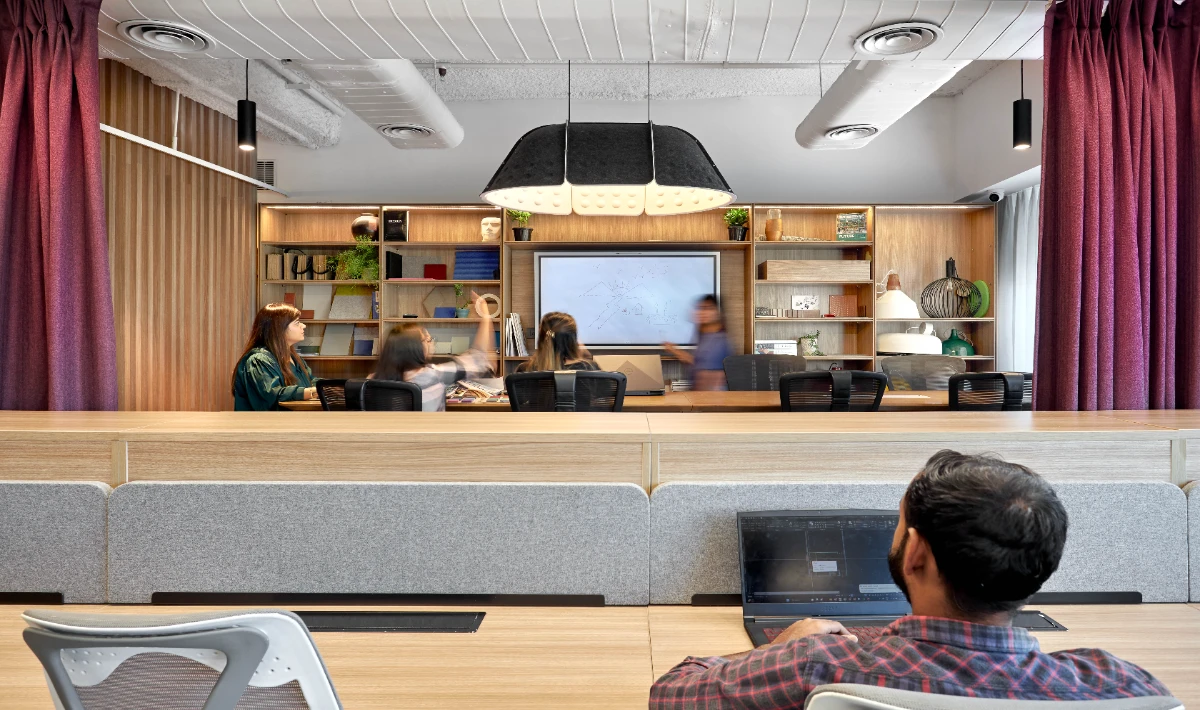 Floating wall shelves for compact and organised office spaces.