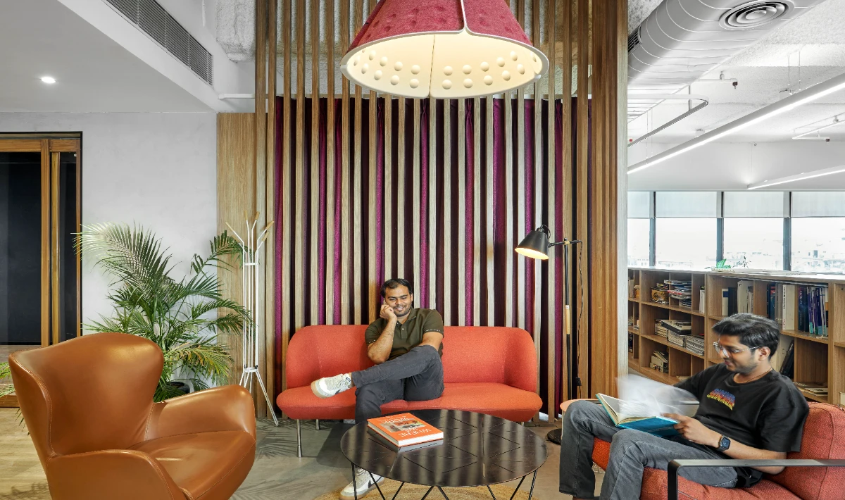 Vertical wooden slat wall design enhancing depth in modern offices