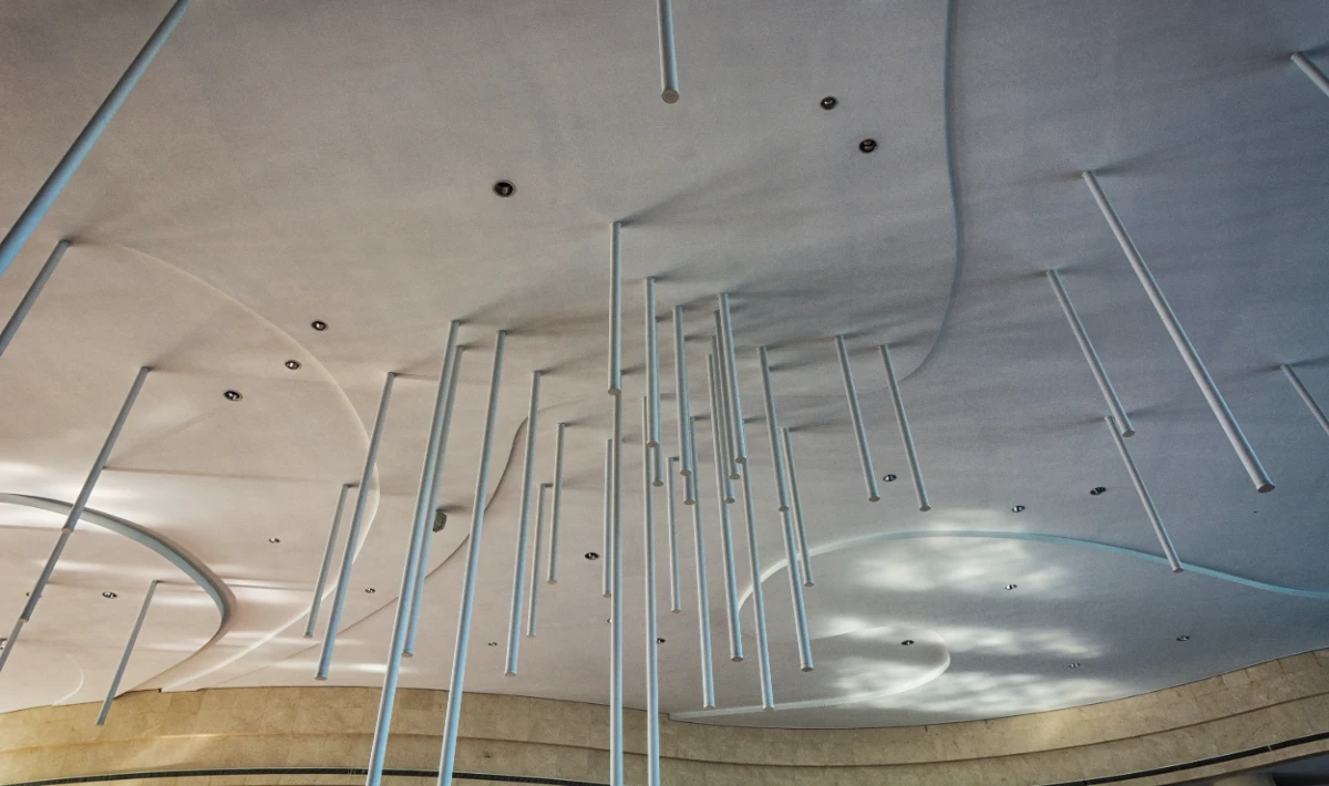 Acoustic gypsum ceiling panels reducing noise in open offices