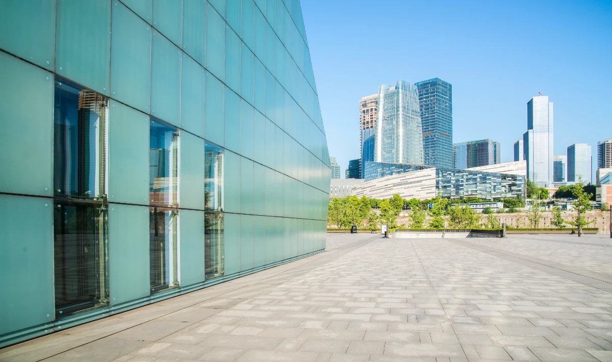 Office exterior design ideas with glass landscaping and warm lights