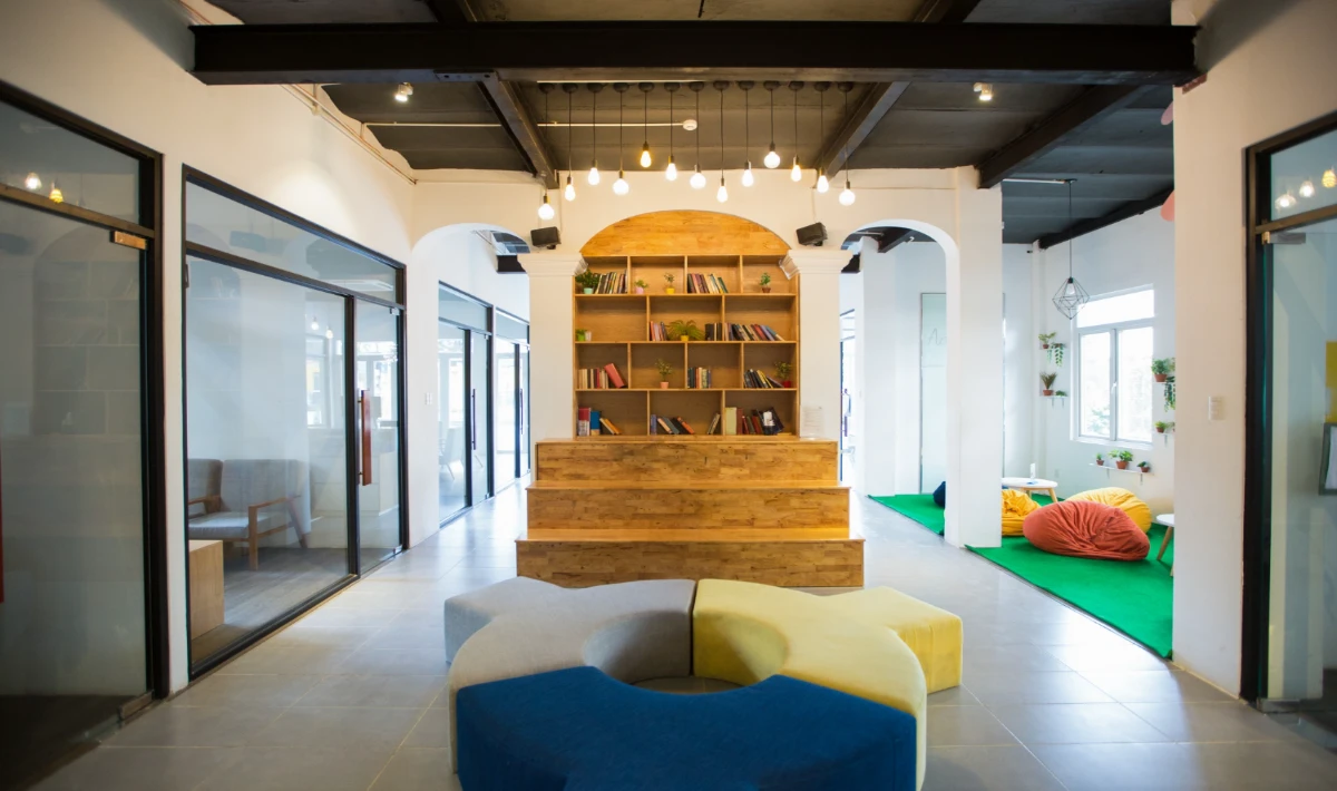 Branded office pantry with company colours and seating areas