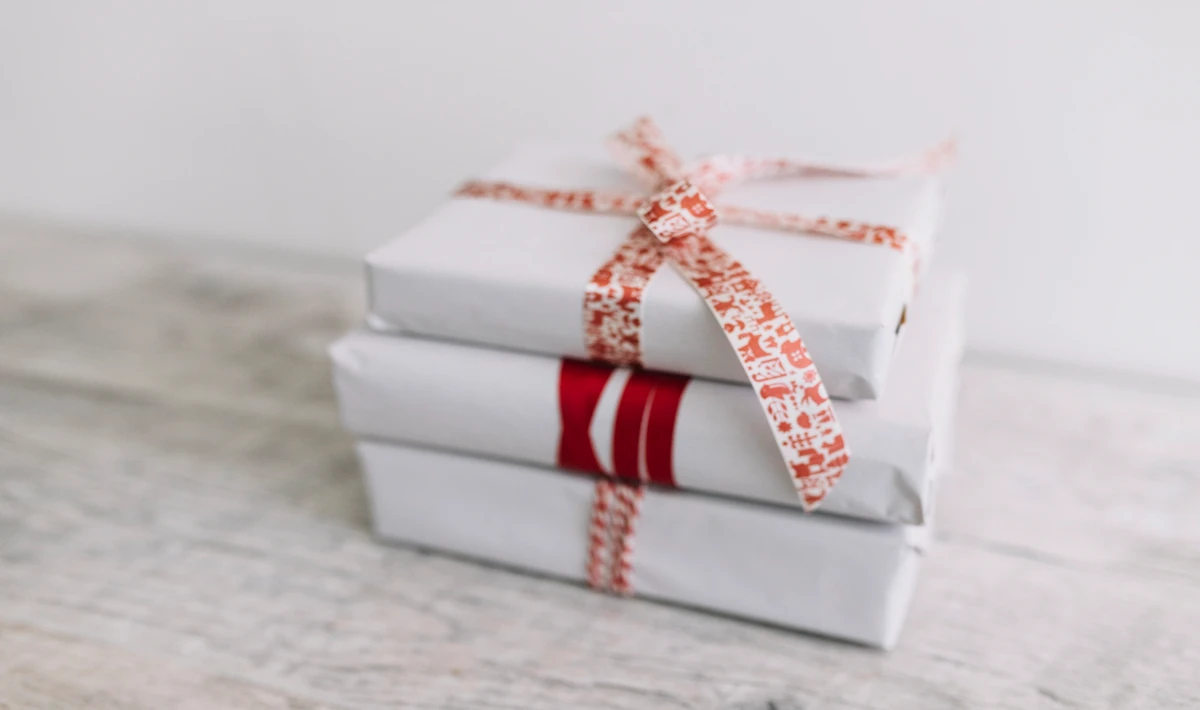 Small white gift boxes placed in office bays to create a winter theme