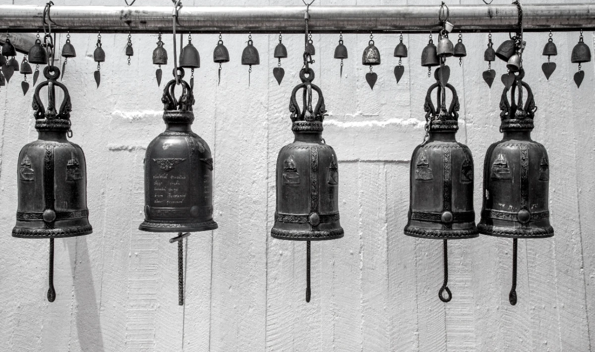 Small Christmas bell clusters hung at the office entrance for a warm sound