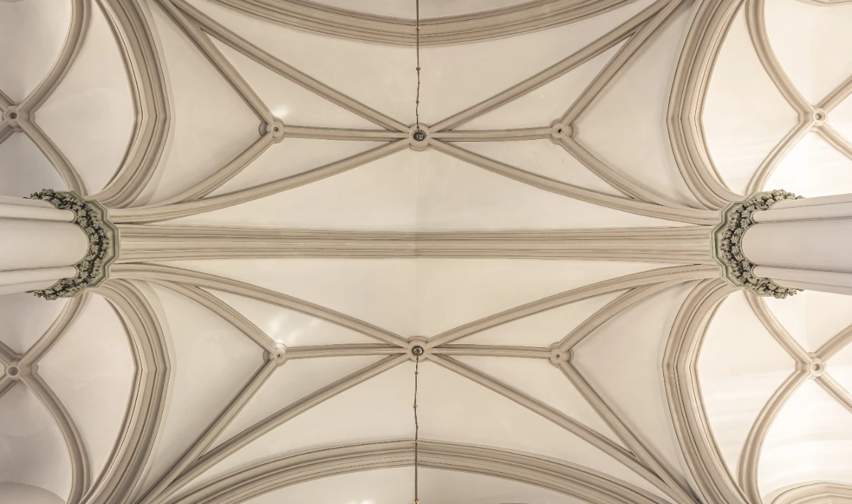 Sculptural wave office ceiling design with exposed grids for an industrial look.