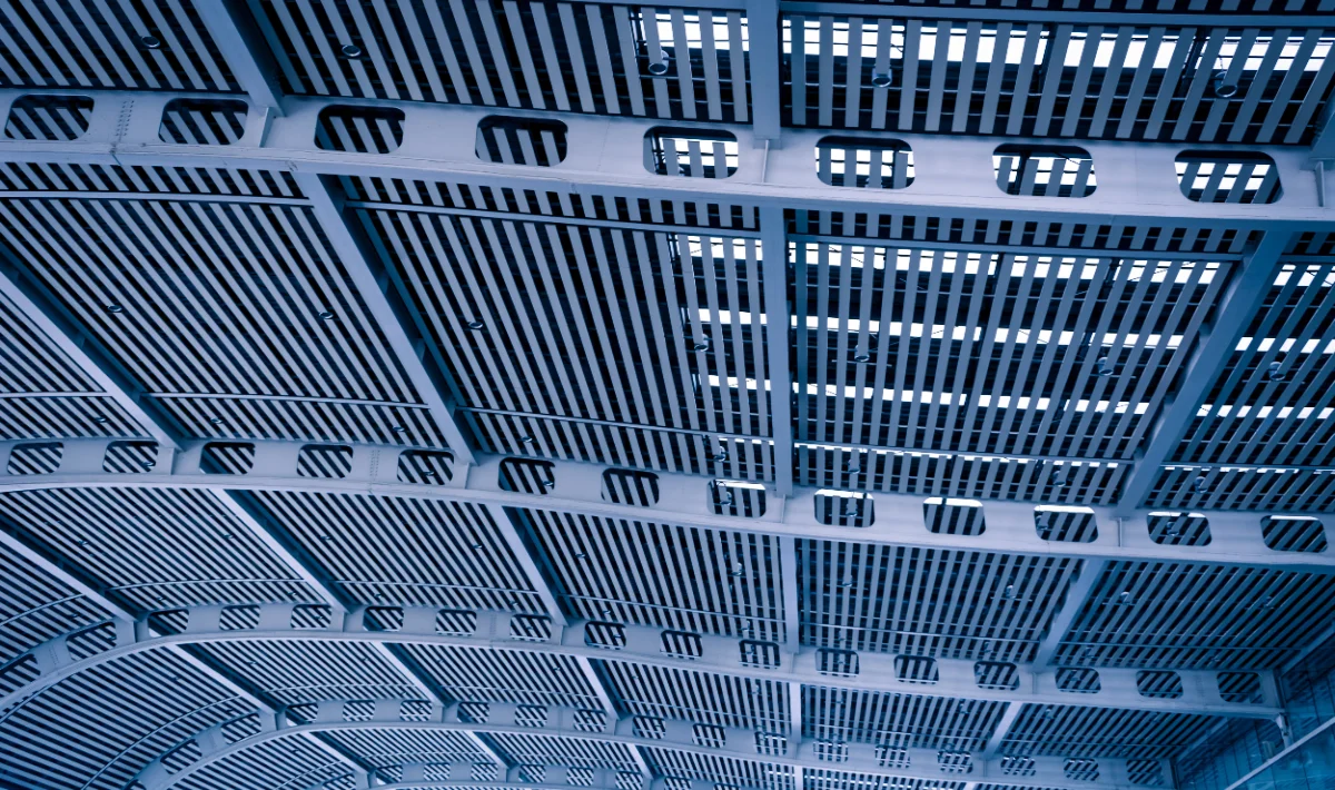Stretch ceiling design for a seamless finish in a modern office space.