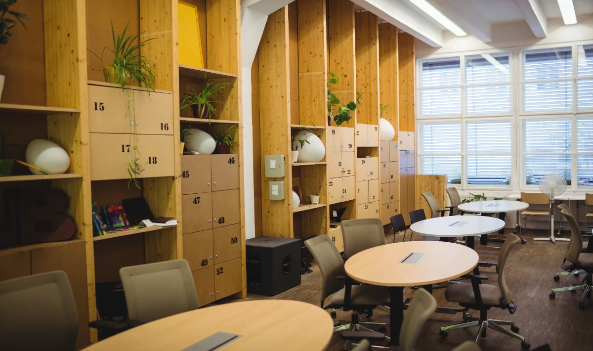 Office furniture layout design with integrated storage near work zones