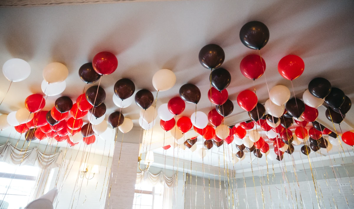 Bright balloon arch at office entrance creating a lively New Year look