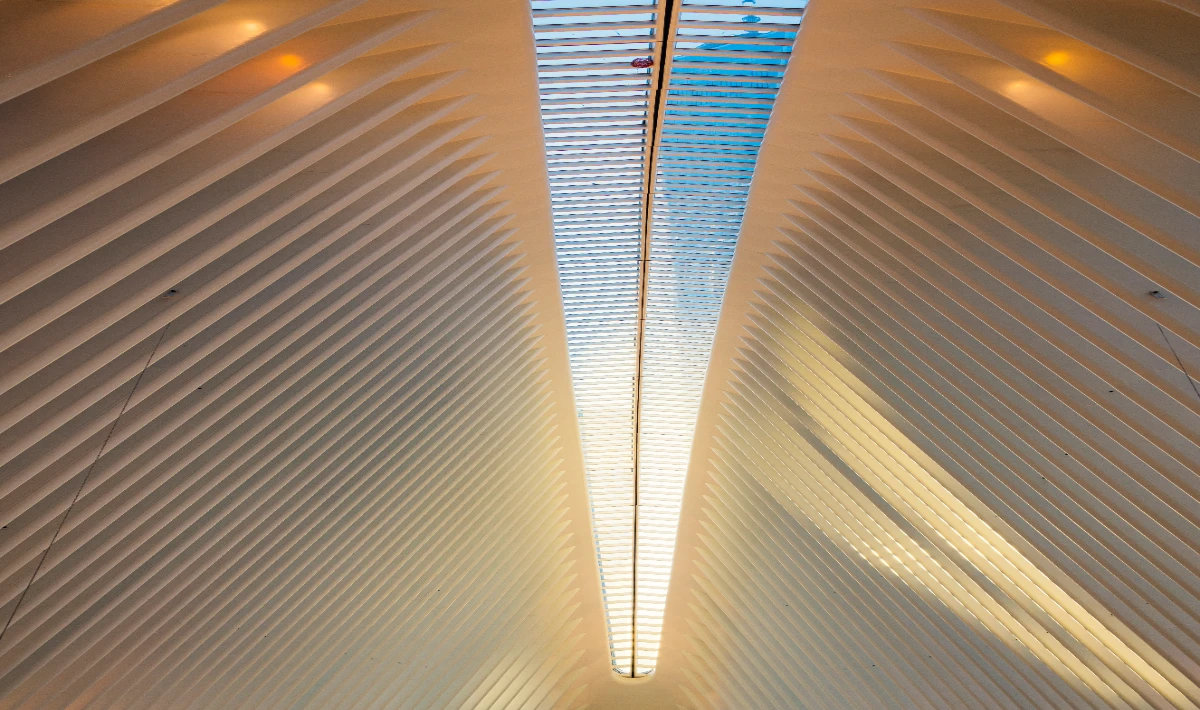 Mirror office ceiling design with reflective mirrors adding visual depth.