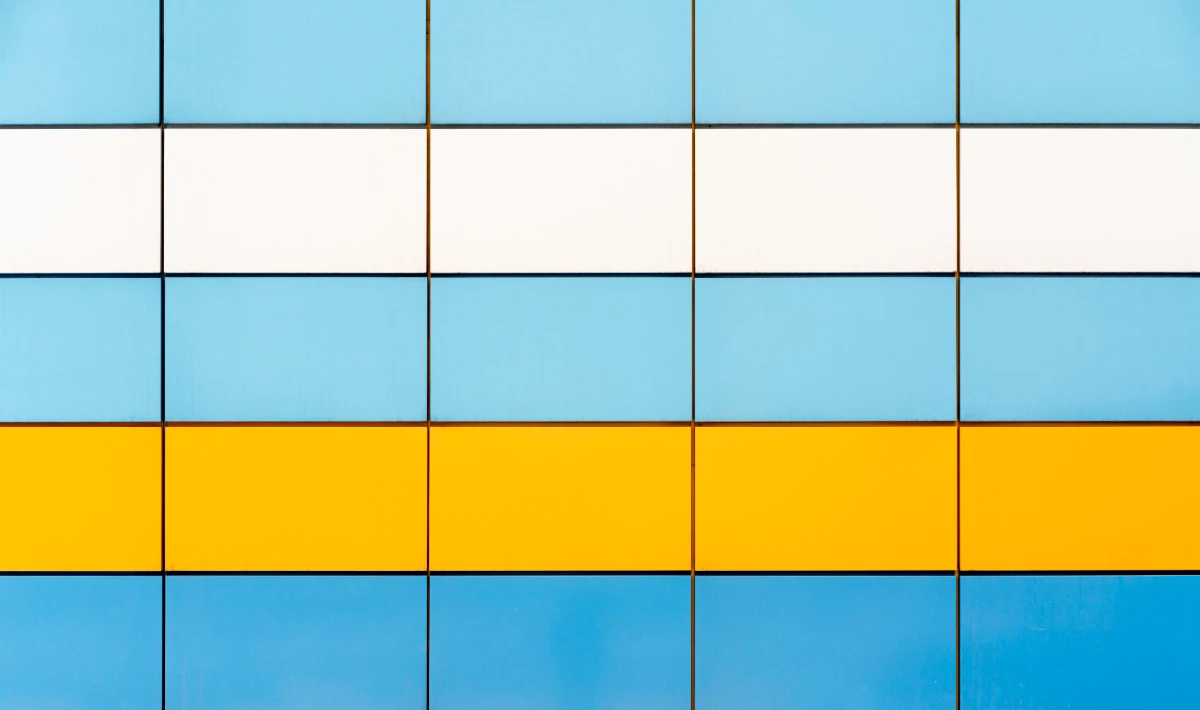 Office wall tiles in brand colours supporting a subtle visual image