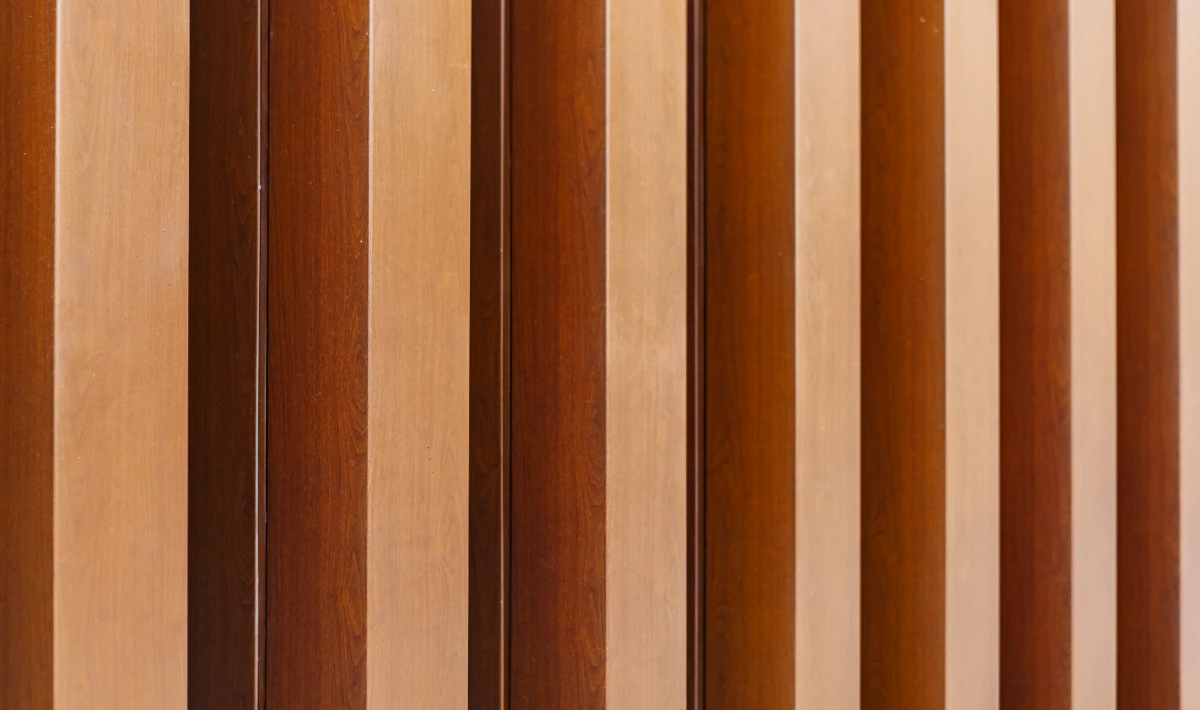 Vertical wood slat wall design improving height and acoustic comfort