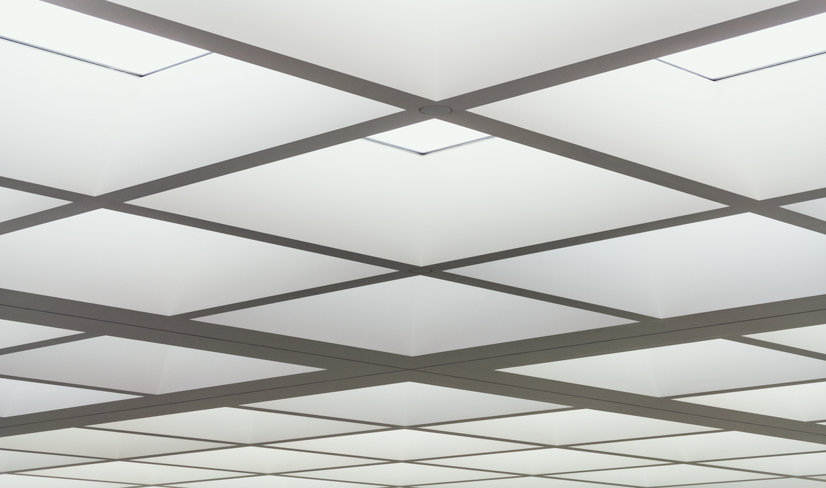 PVC false ceiling design featuring lightweight and waterproof panels.