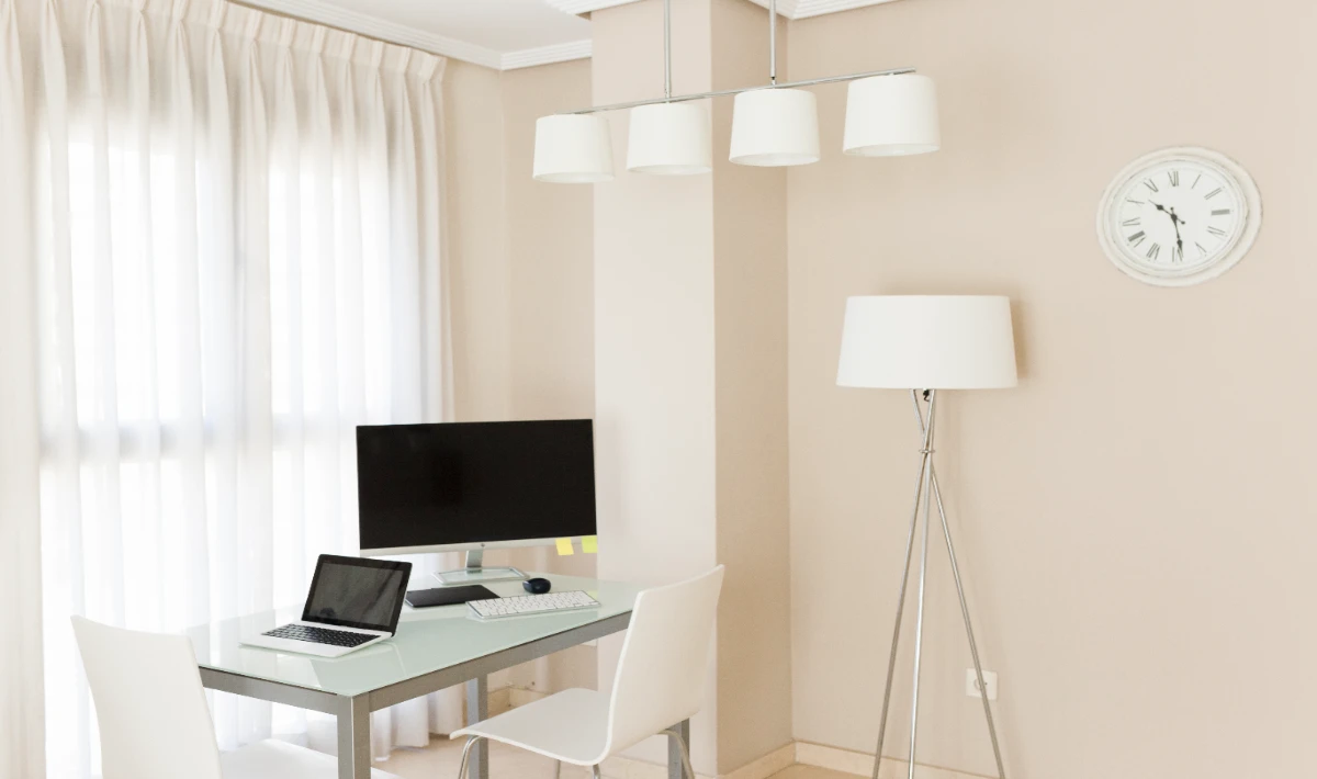 Light colour walls in small office interior design for an open feel