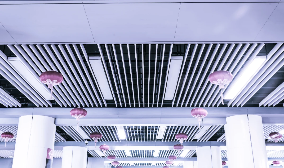 Office ceiling design: LED light bars creating angular visual rhythm.